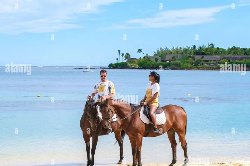 Horse riding along palm beach Mauritius